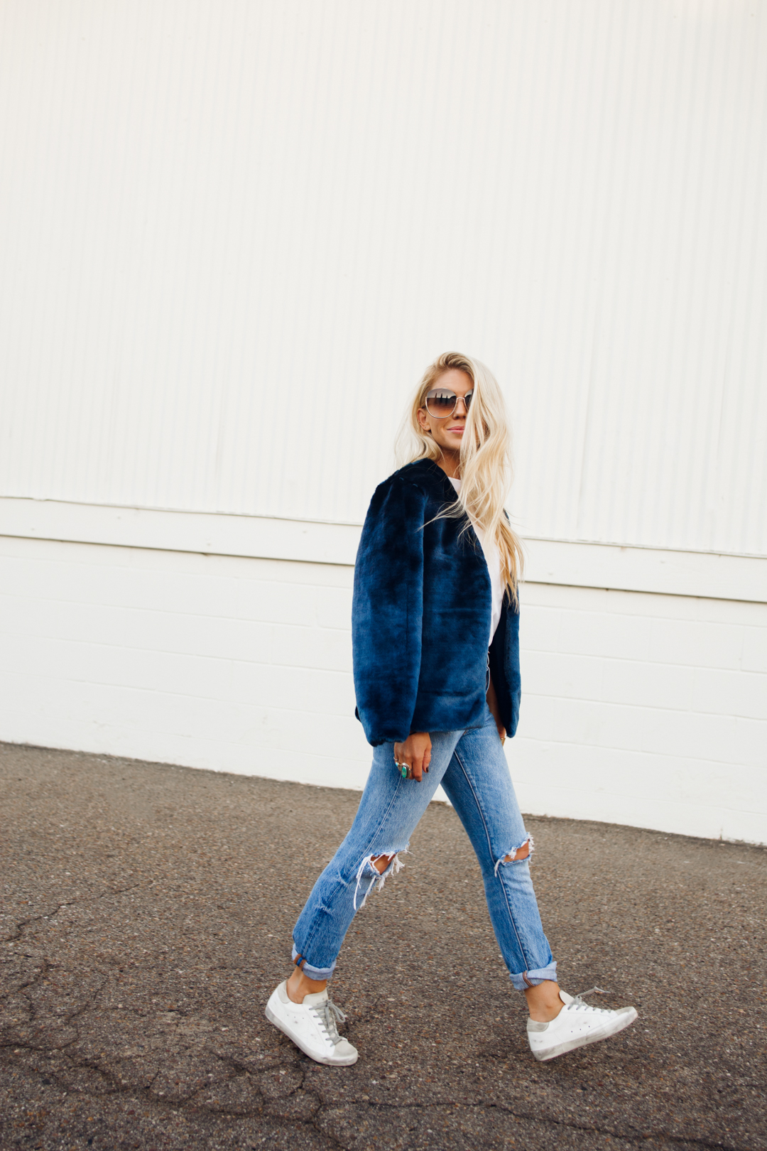 Lisa Allen of Salty Lashes wearing a Faux Fur from Revolve with Levi's 501, Golden Goose and a Re/Done Tee