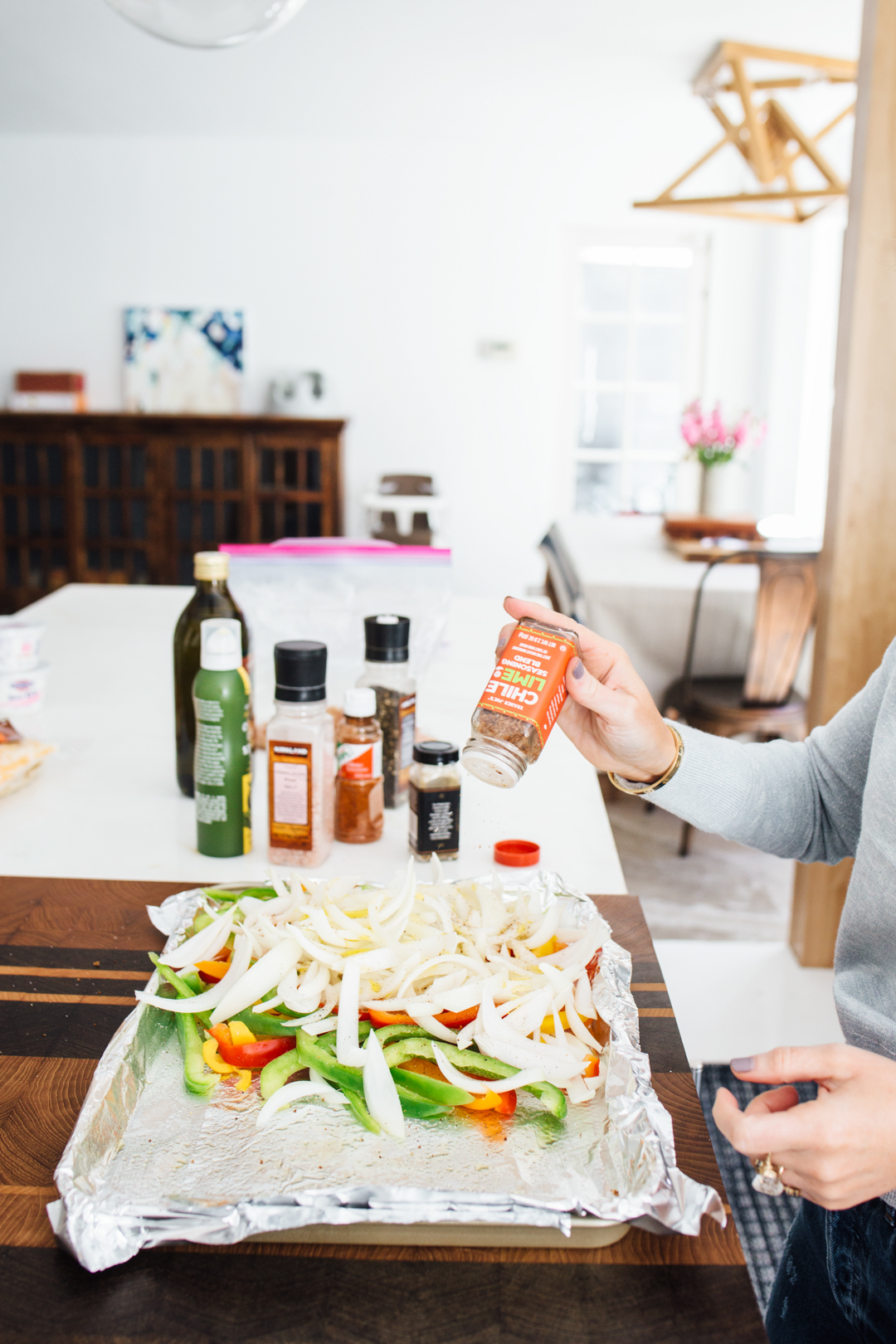 Lisa Allen of Salty Lashes making one pan chicken fajitas using Trader Joe's Chili Lime Seasoning 