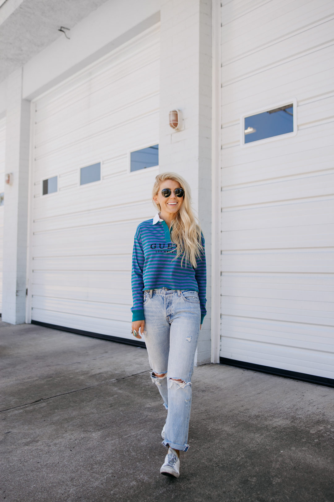 Lisa Allen of Salty Lashes wearing a Guess Rugby Top with Levi's and Golden Goose in Encinitas California