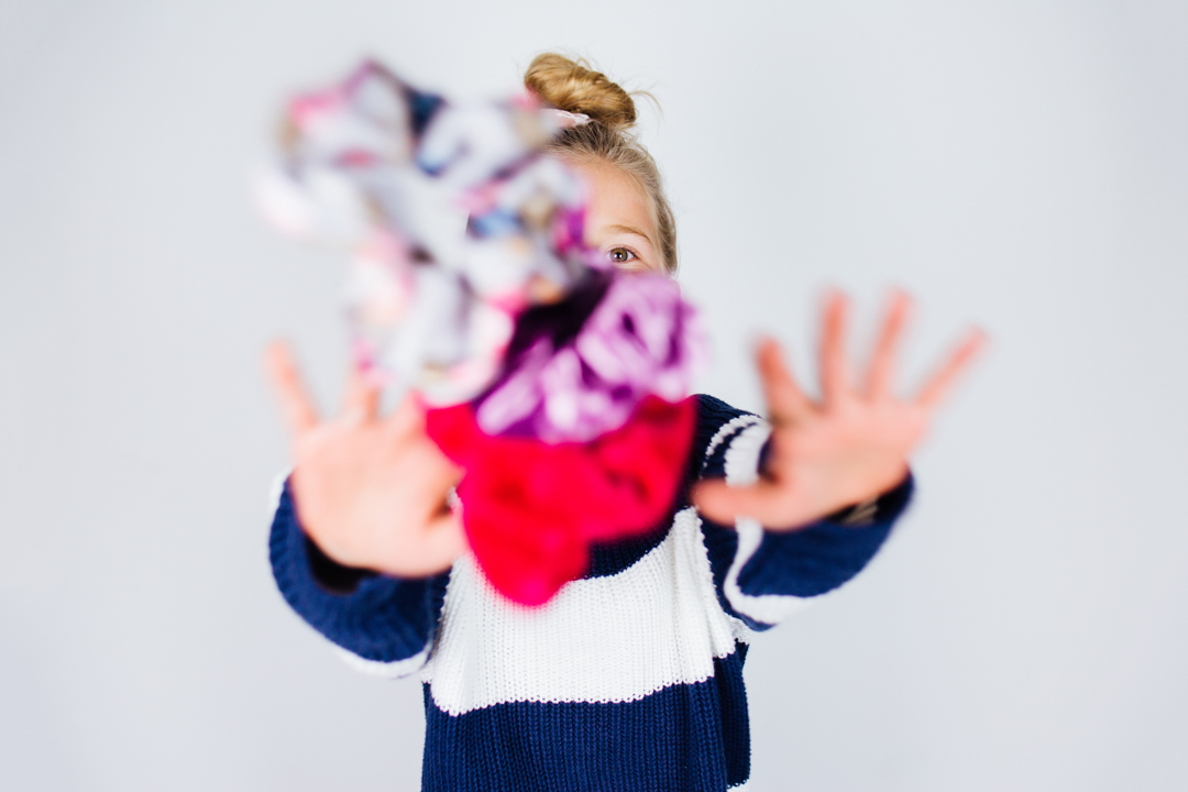 Lisa Allen of Salty Lashes showing how to create a 30 second Topknot hair tutorial for kids 