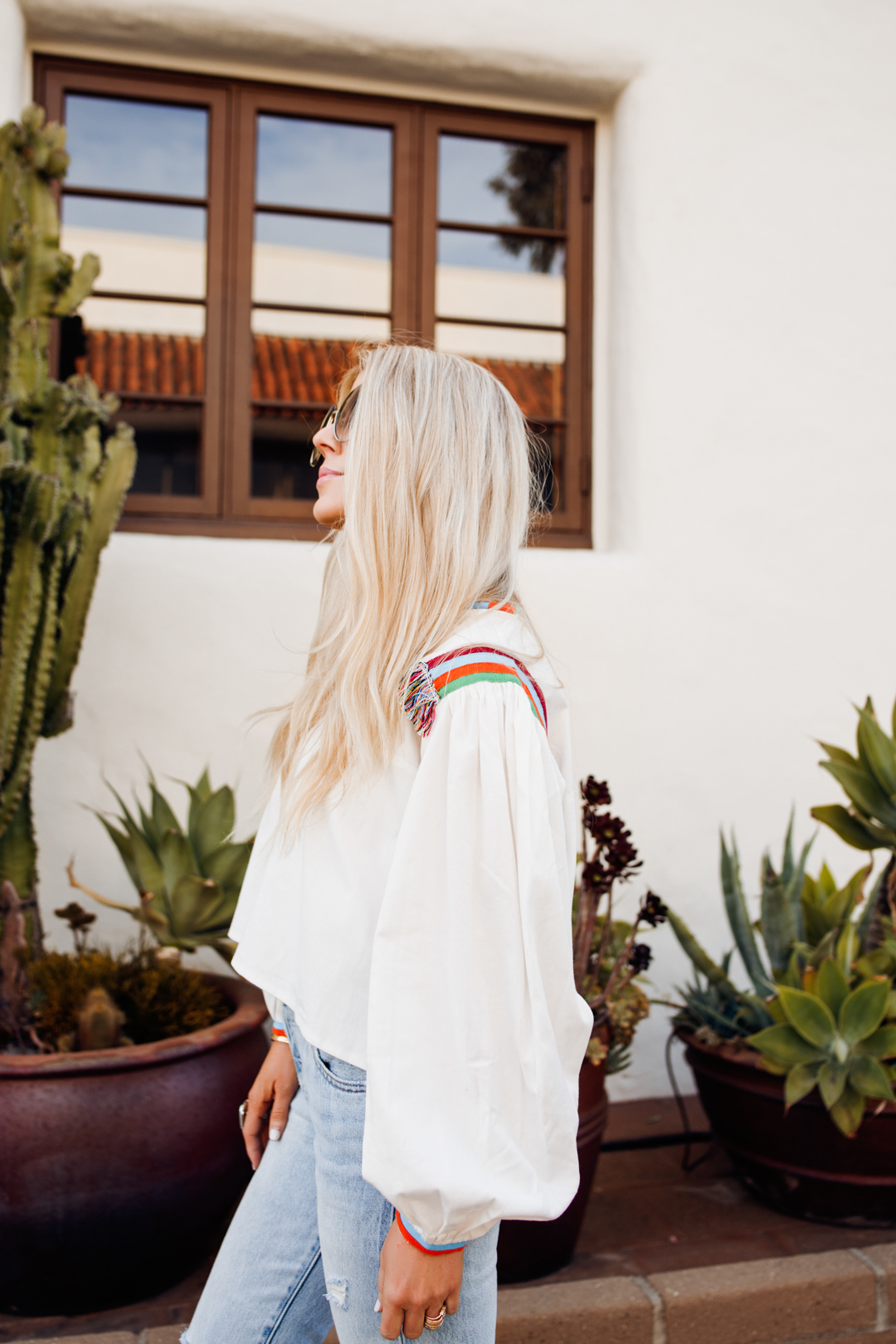 weekend sales - salty lashes wearing WHITE TOP - JEANS - SUNGLASSES - SANDALS