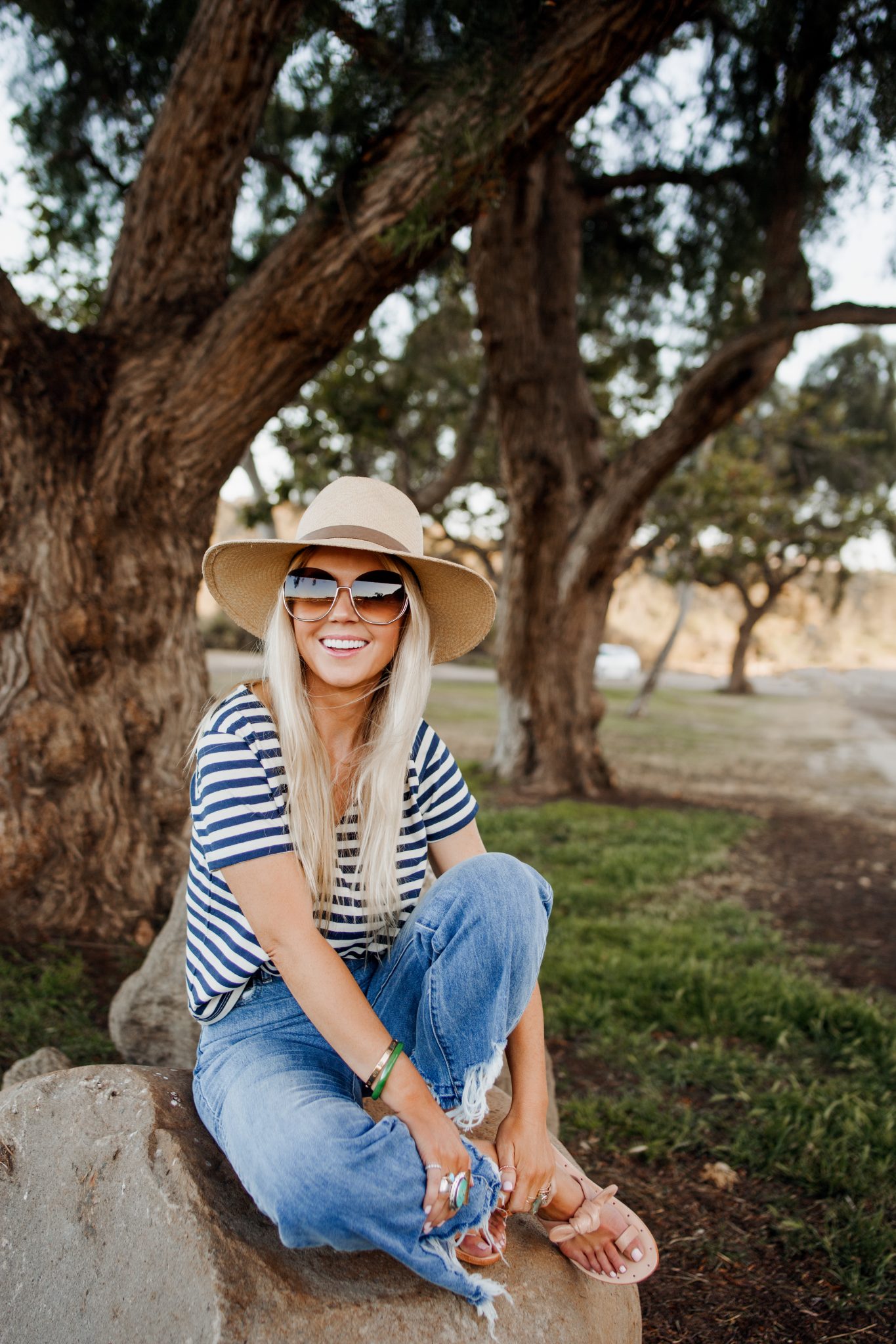 Lisa Allen of Salty lashes wearing a stripe Madewell shirt with gaucho 1961 jeans, and Chloe sunglasses Lisa Allen of Salty lashes wearing a stripe Madewell shirt with gaucho 1961 jeans, and Chloe sunglasses