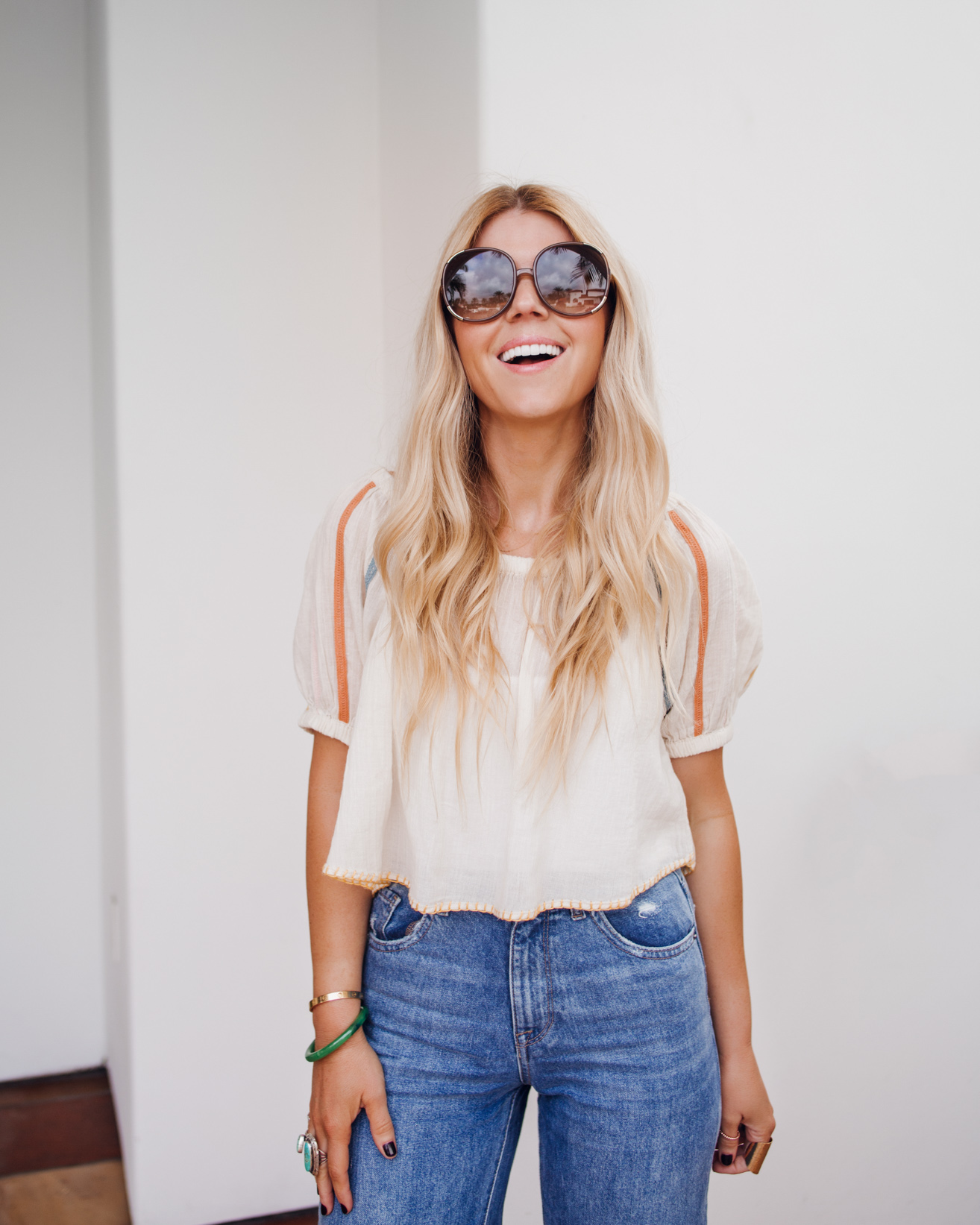 lisa allen of salty lashes wearing a UO peasant top one of her tops for summer with DL1961 jeans, free people wedges and chloe sunglasses