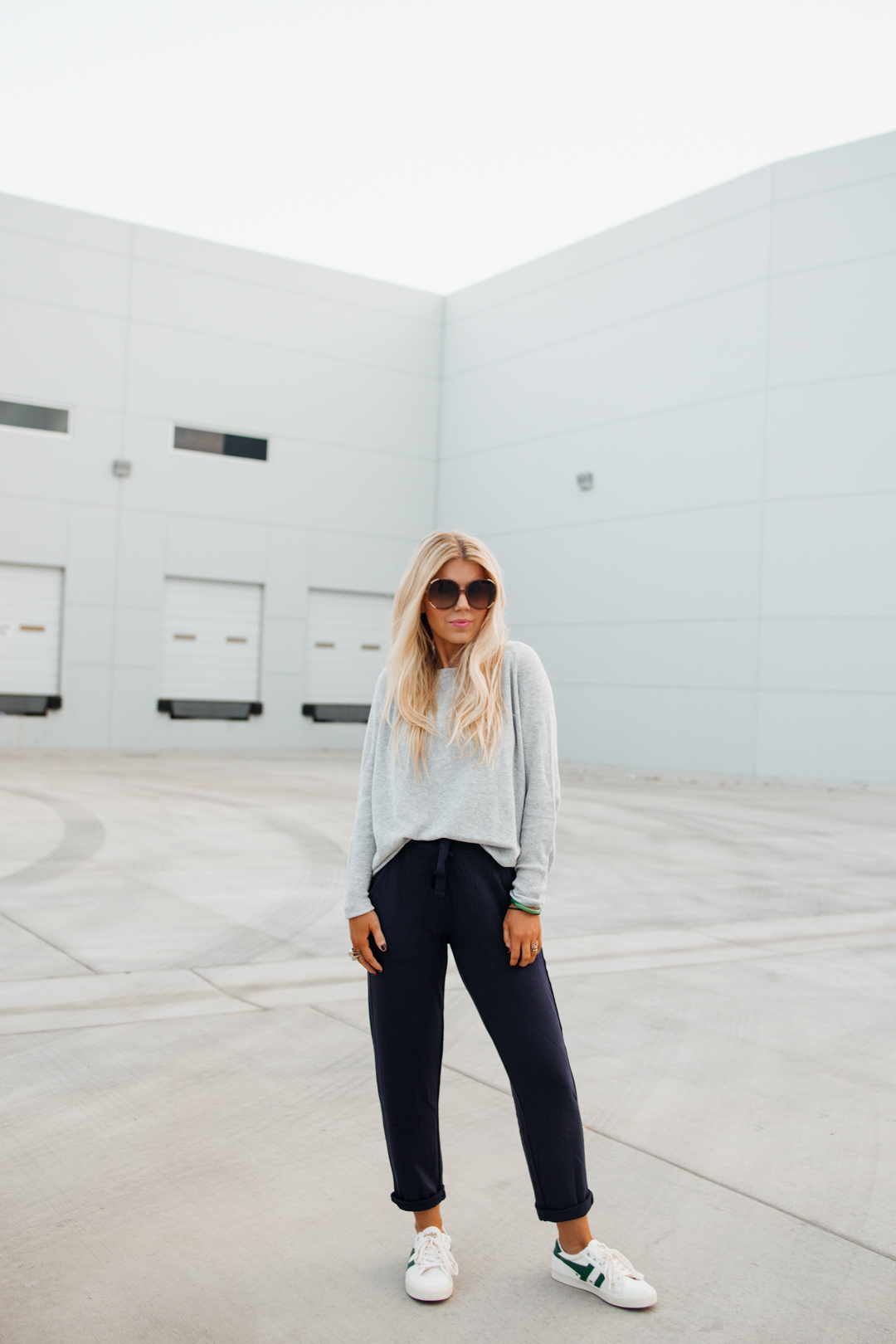 Lisa Allen wearing a comfortable Lou & Grey sweater, navy jogger pants and Gola sneakers for an effortless casual style.