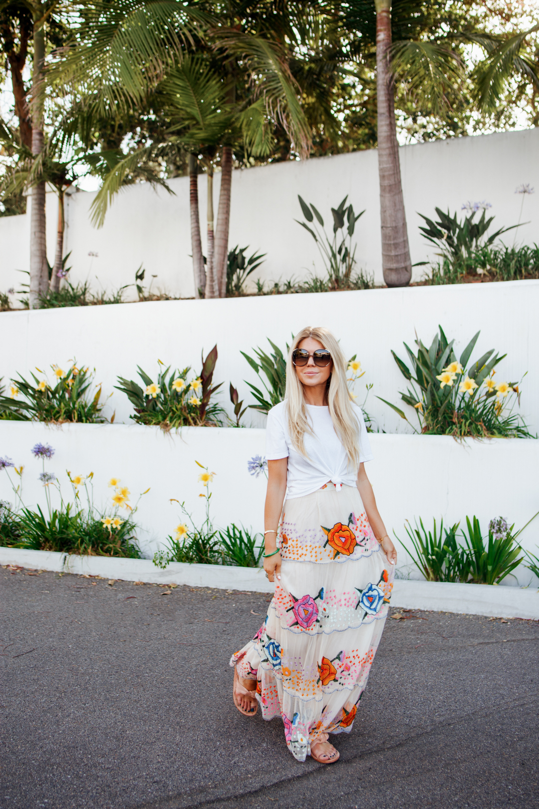 Summer outfit featuring Lisa Allen of Salty Lashes in an Urban Outfitters summer maxi skirt, white Vince tee, Week sandals, and Chloe sunglasses.