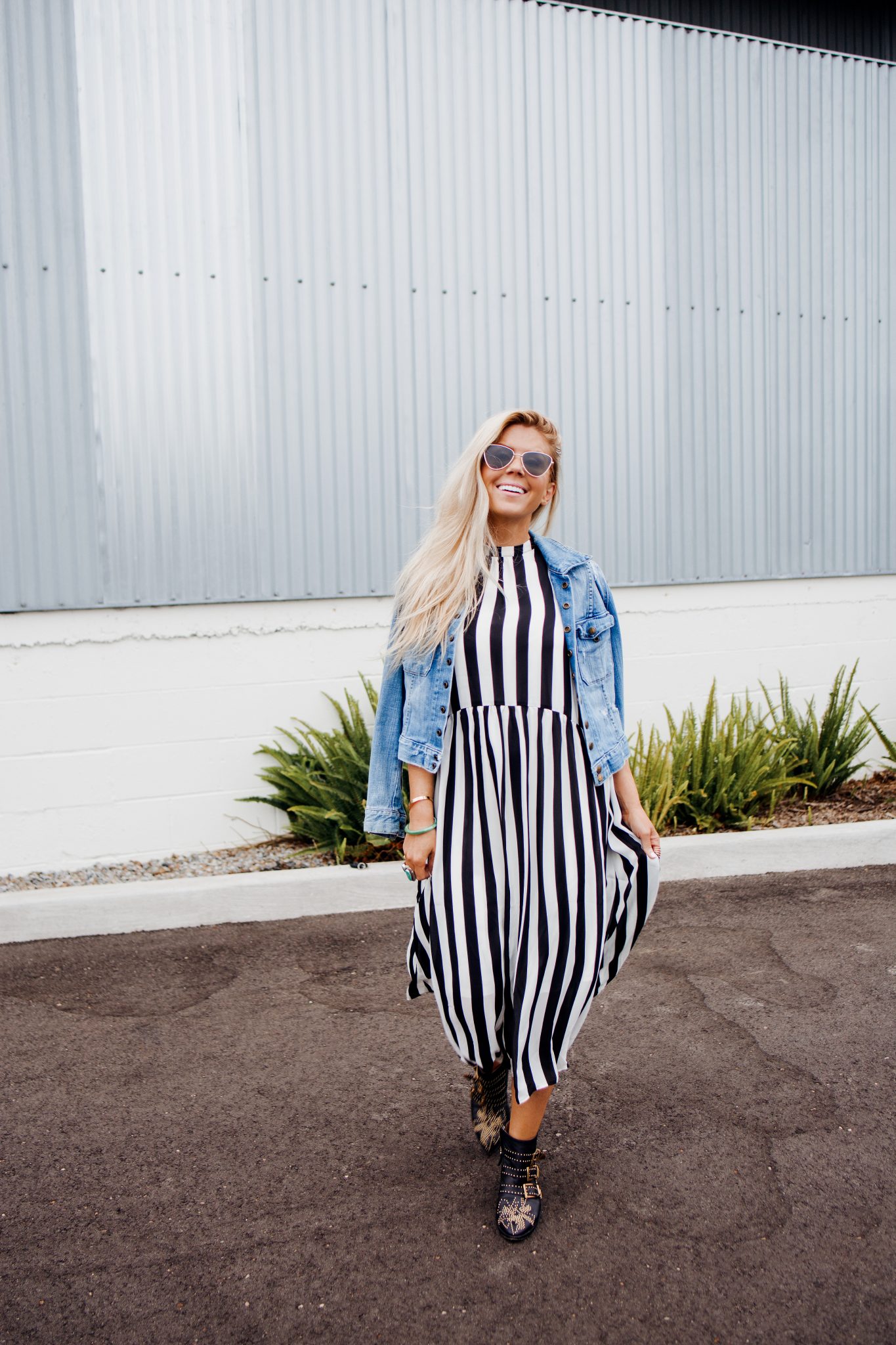 lisa allen of salty lashes wearing a stripe asos jacket with Chloe booties and le spec sunglasses