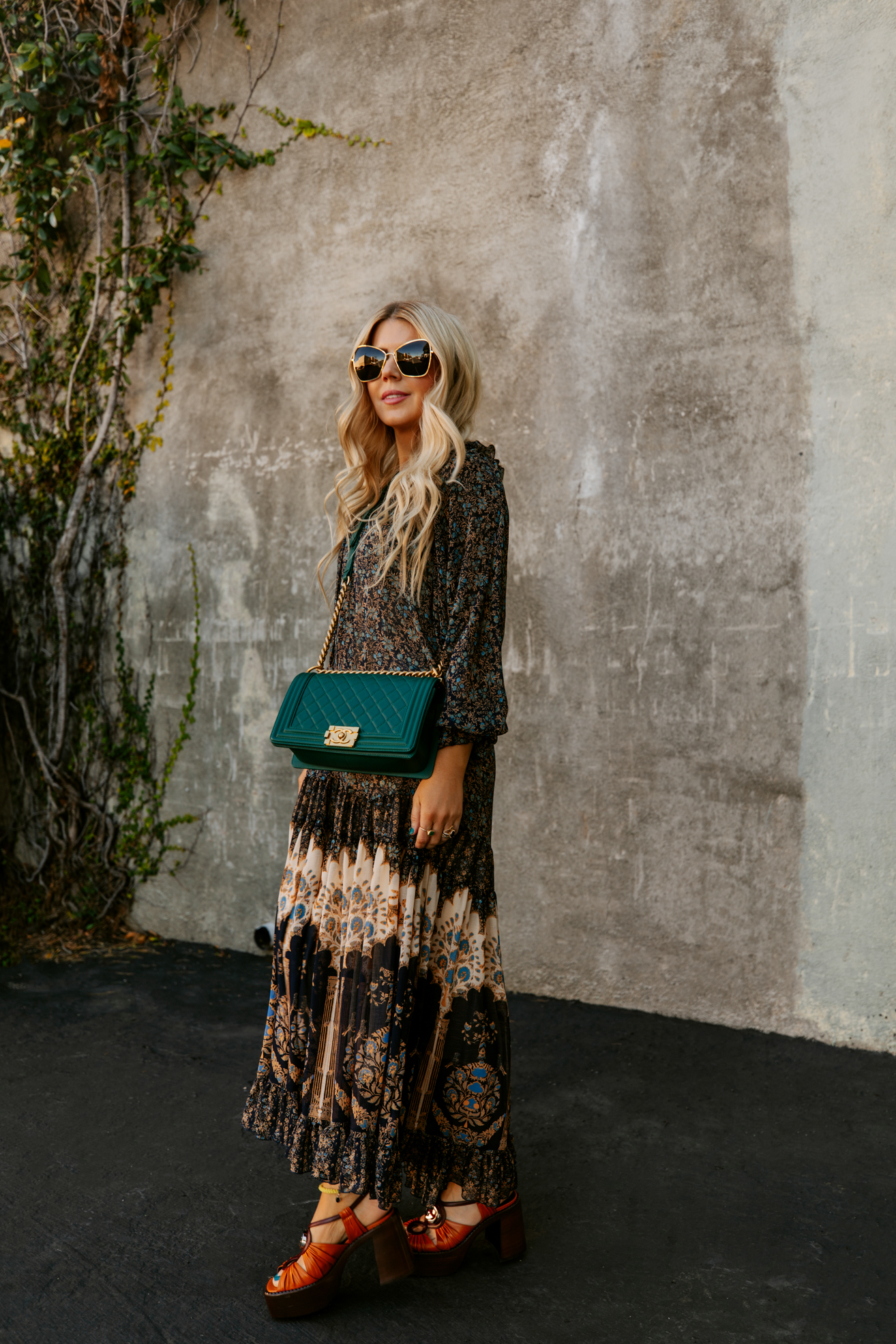 Salty Lashes wearing a dress, Gucci platform, Chanel bag and sunglasses