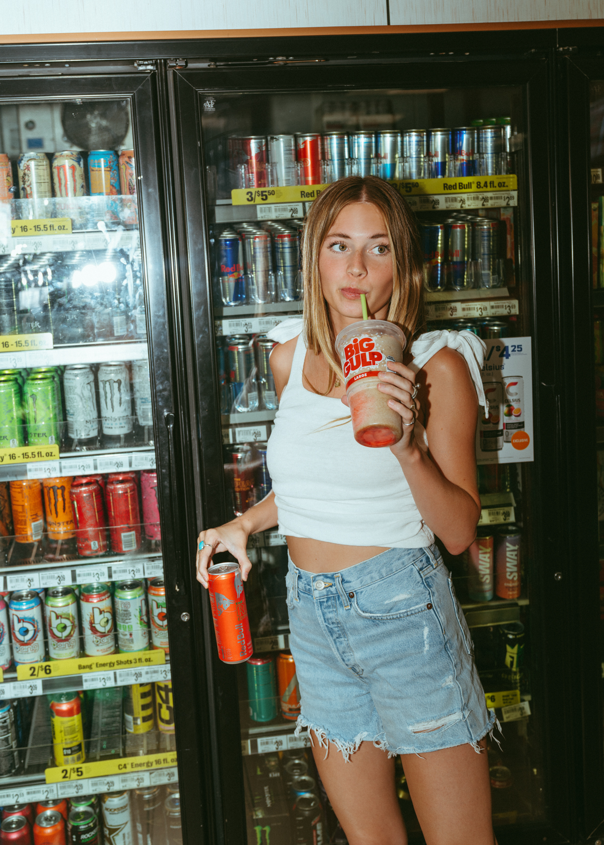 Avery Senior Year an  American Teenage photographed in a convenience store drinking big gulp