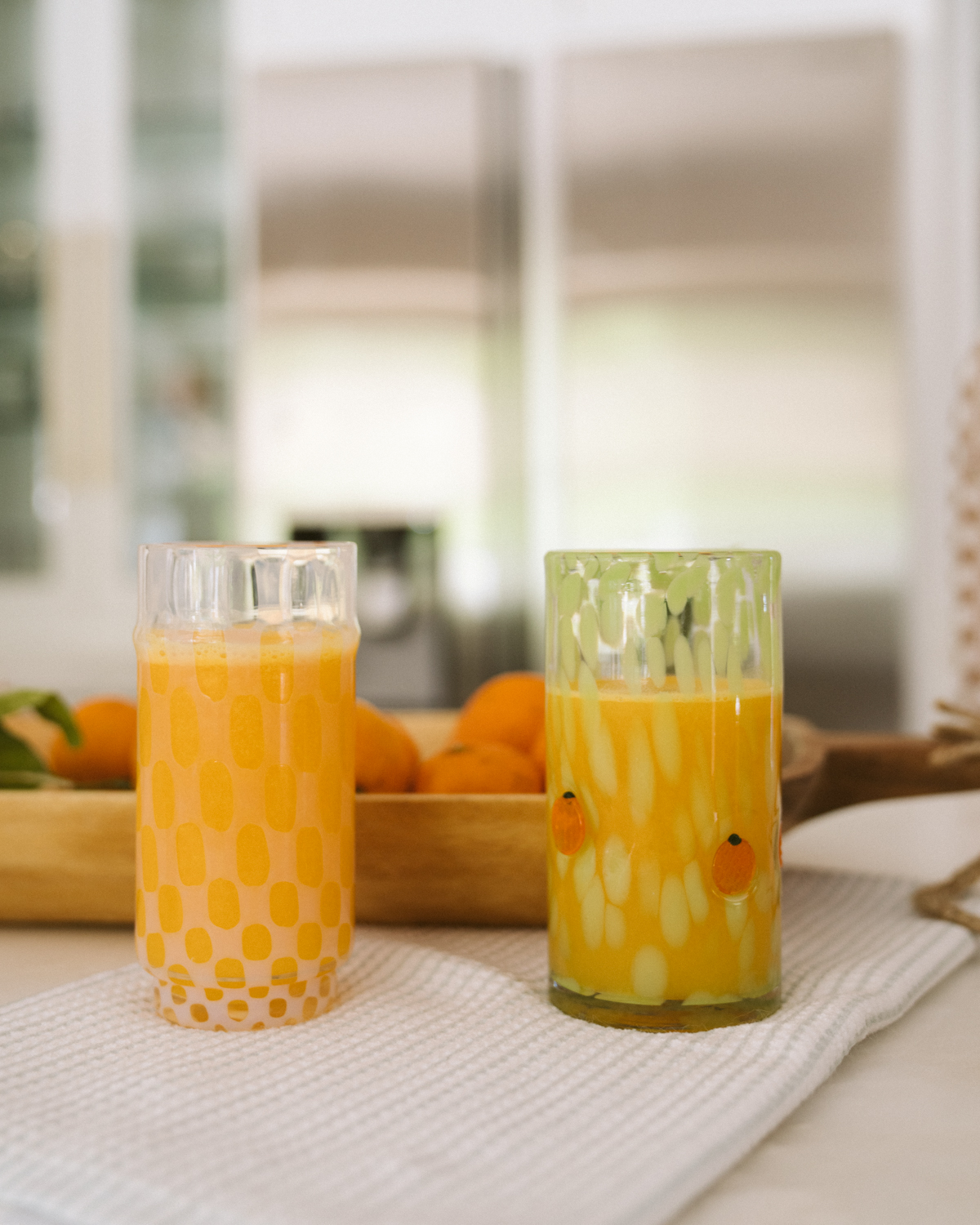 two glasses of orange juices