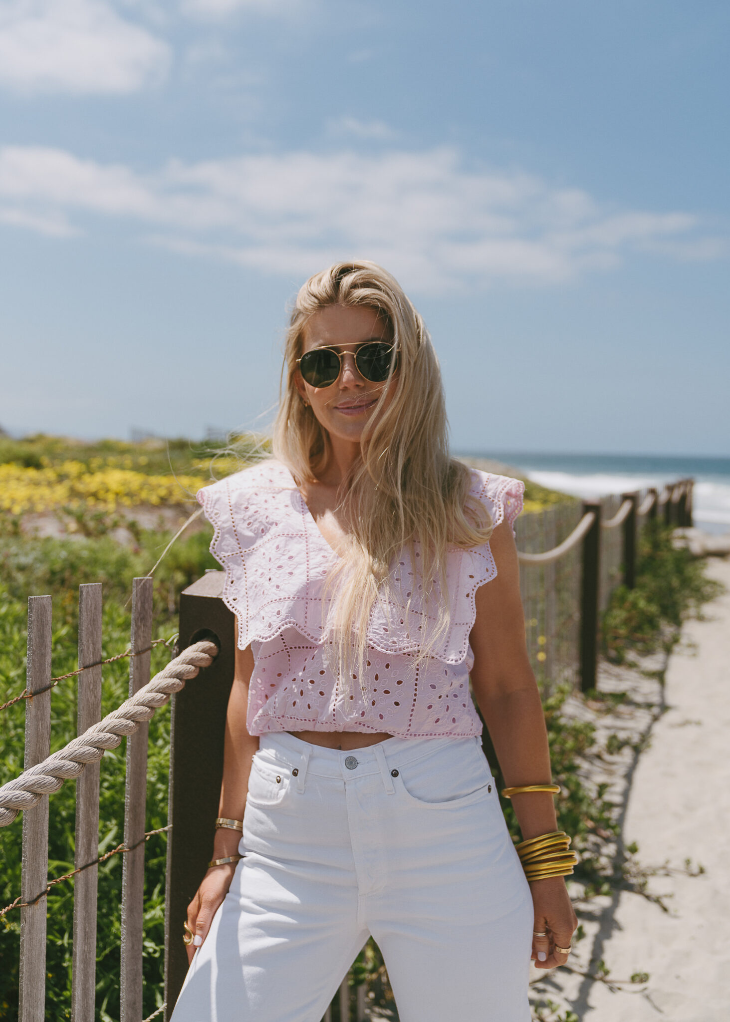woman in pink eyelet top and white pants from Summer Styles With Nordstrom