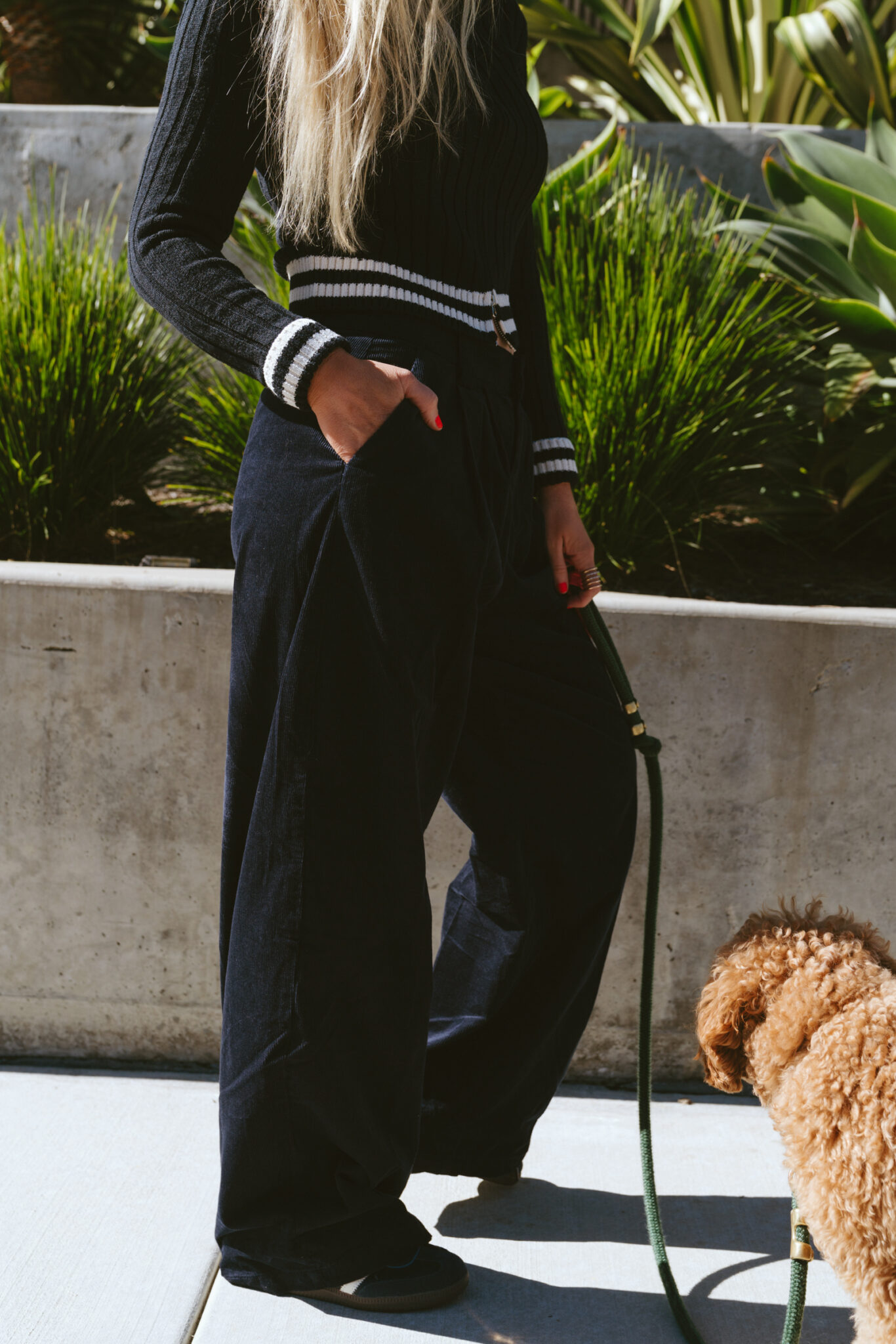 woman wearing black pants from UO Holiday Wishlist