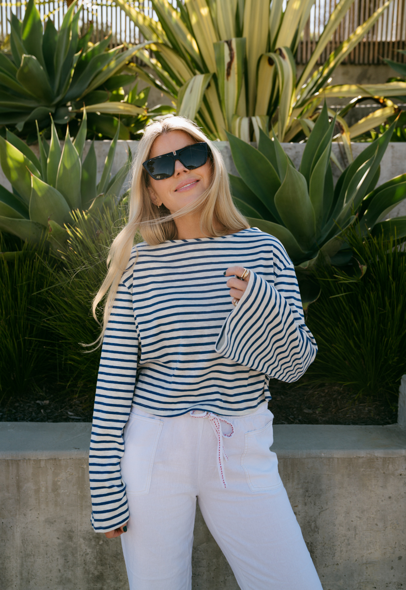 woman wearing striped top for spring at Urban Outfitters