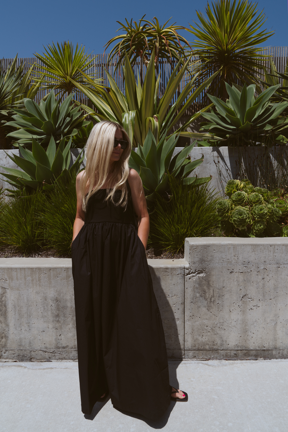 Salty Lashes Blogger Lisa Allen wearing black tube dress with pockets from New Arrivals with Walmart